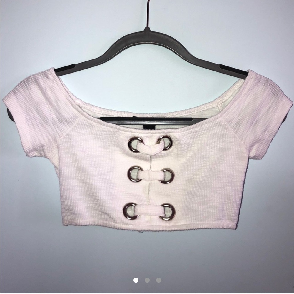 Adorable crop top with silver ring detailing.